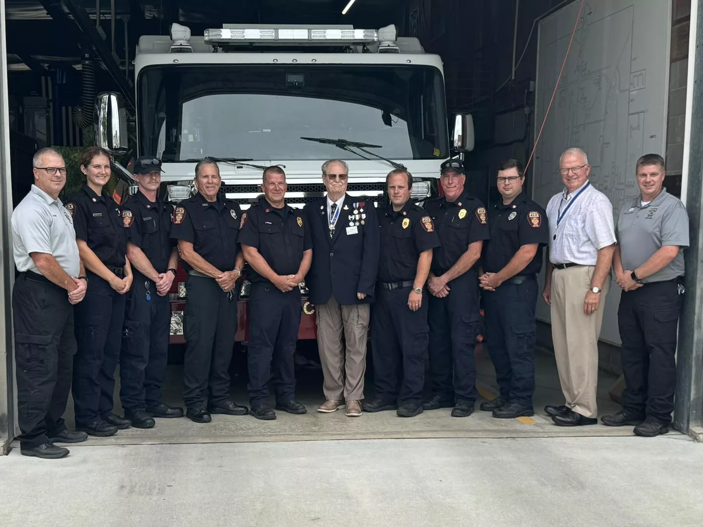 Group photo of award recipients with Fire Chief Mark Manuel^ Deputy Fire Chief Matt Willings^ and SAR representatives Gene Henry and Michael Powers