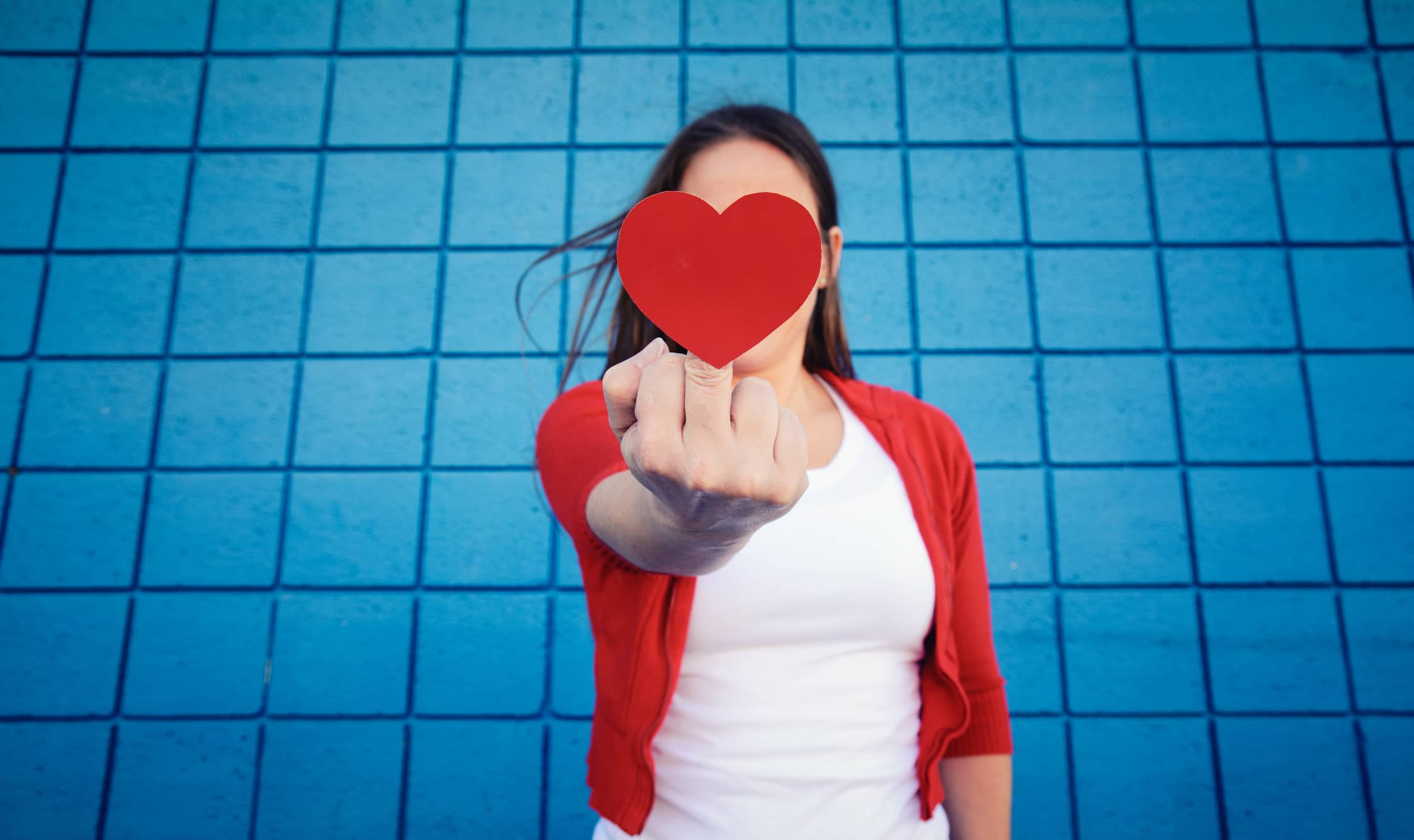 woman-with-a-heart-on-her-middle-finger