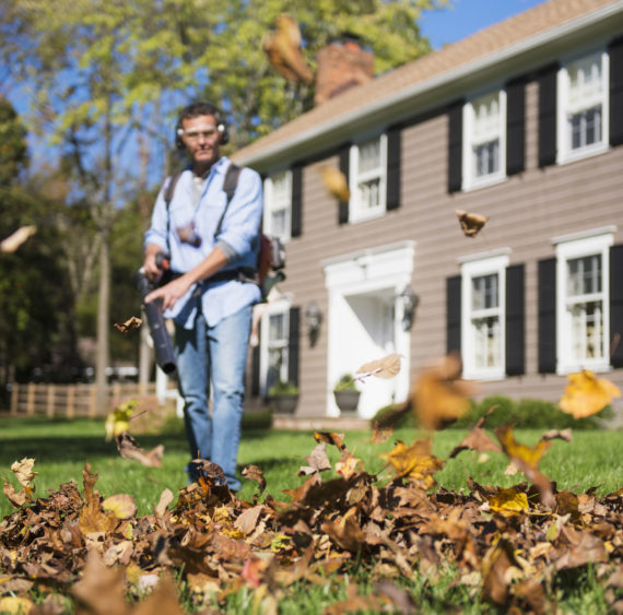 usa-new-jersey-mendham-man-using-leaf-blower-in-front-yard