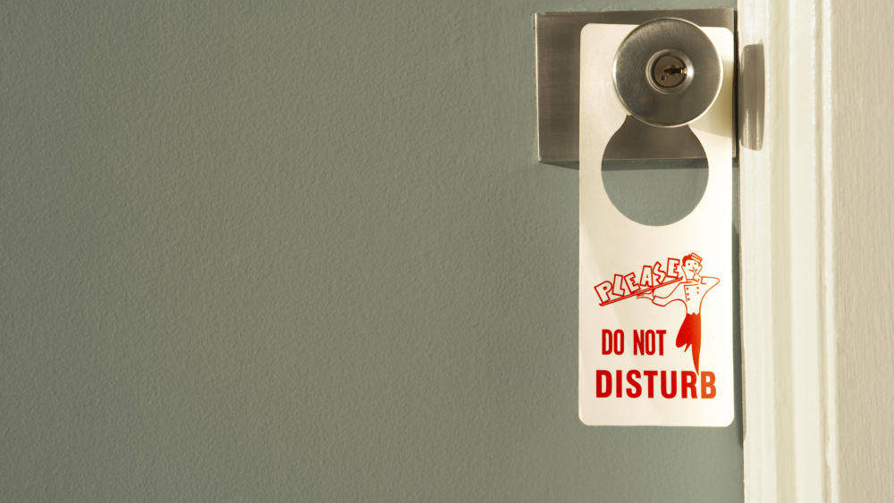 do-not-disturb-sign-on-doorknob-close-up