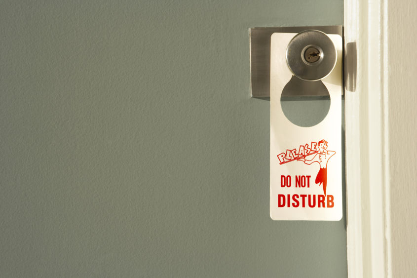 do-not-disturb-sign-on-doorknob-close-up