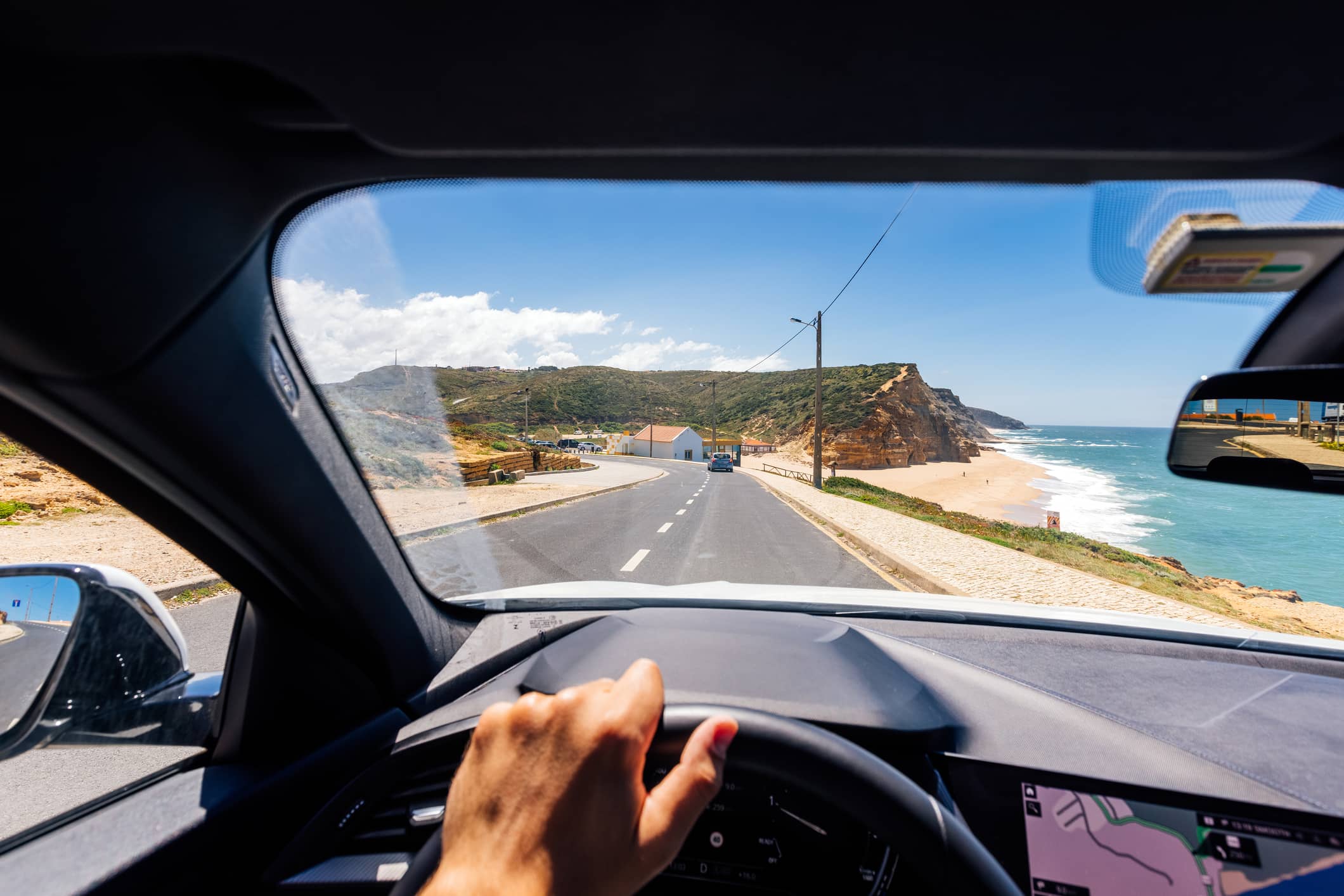 personal-perspective-point-of-view-of-a-man-driving-along-the-atlantic-coast-in-portugal