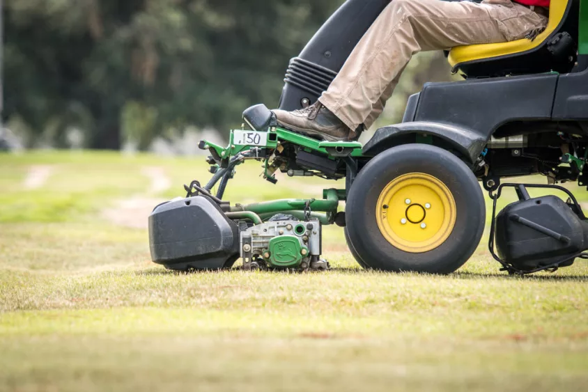 man-using-ride-lawn-mower-to-cut-turf-grass-tifton-georgia