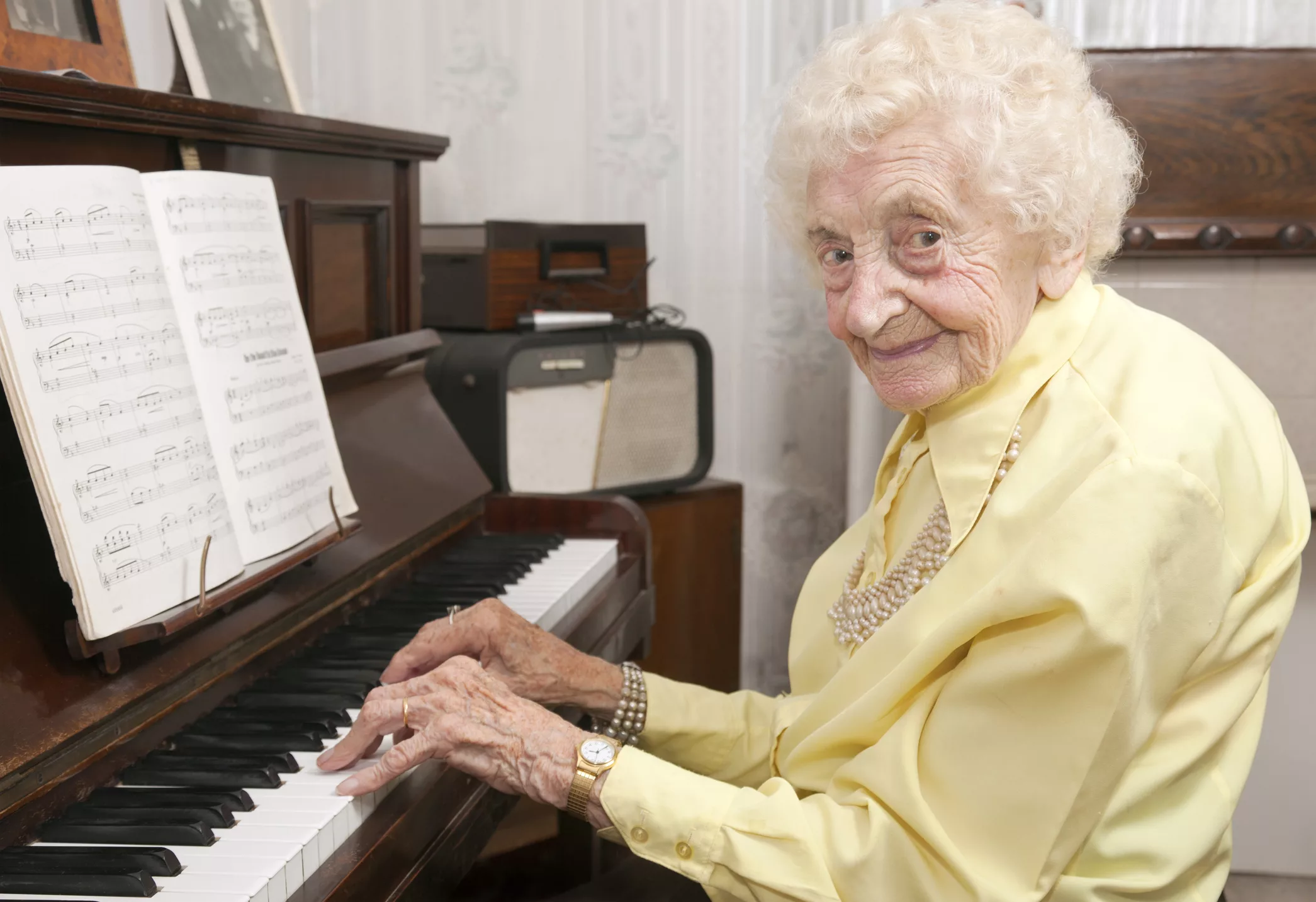 elderly-lady-playing-piano-at-home