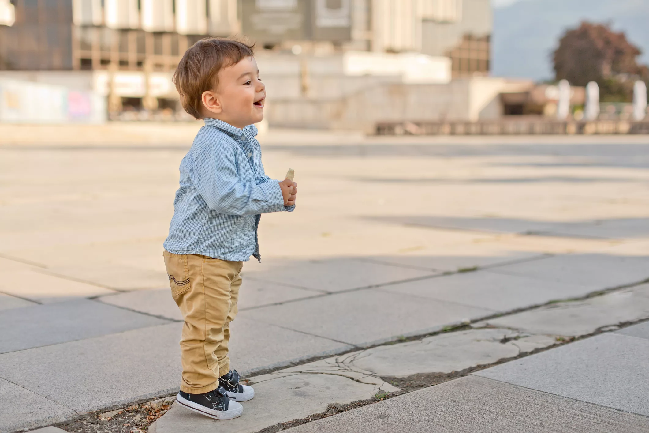 profile-view-of-toddler-boy-on-tiptoe