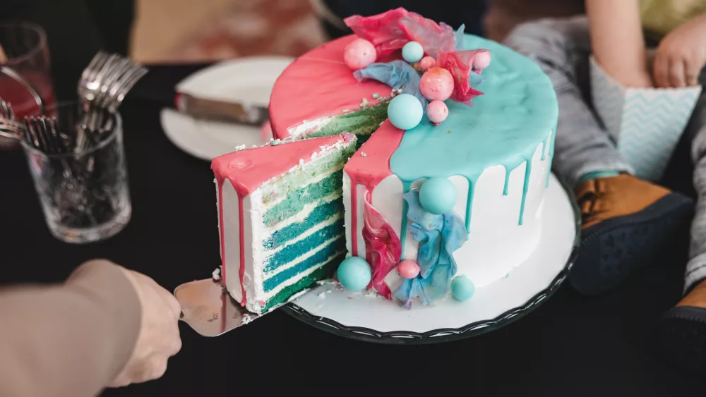 a-delicious-cake-being-cut-to-reveal-the-babys-gender