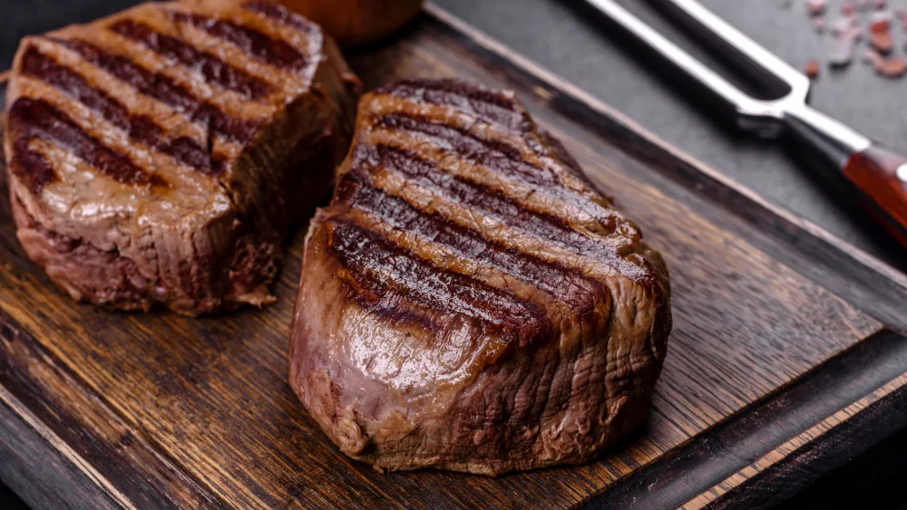 fresh-juicy-delicious-beef-steak-on-a-dark-background