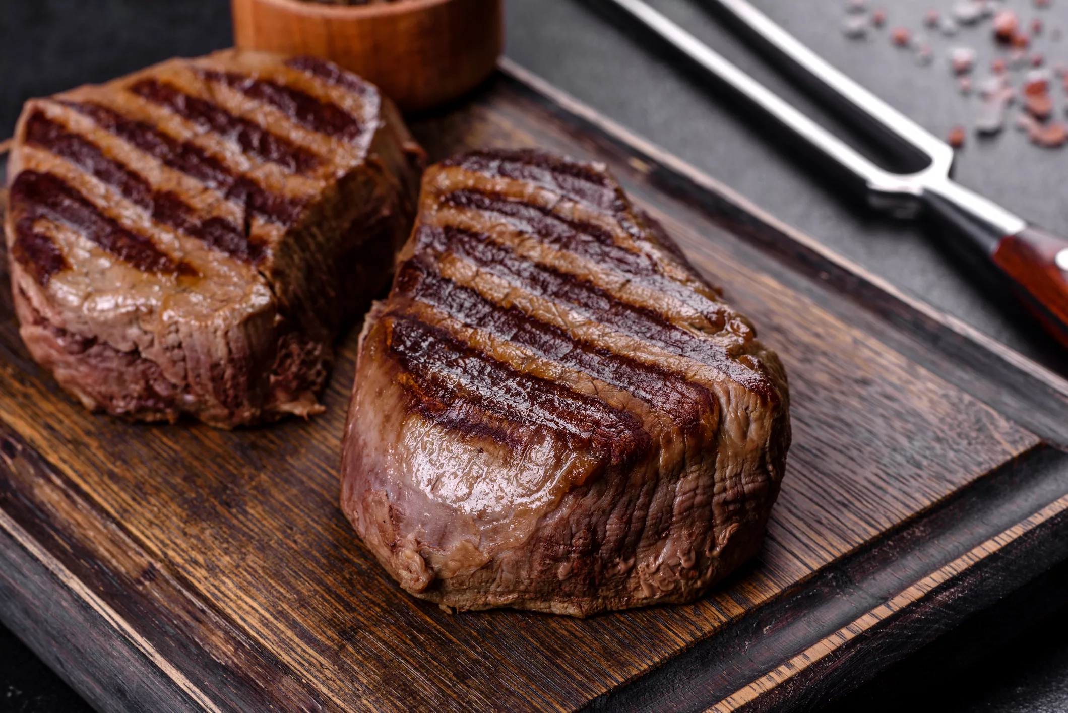 fresh-juicy-delicious-beef-steak-on-a-dark-background