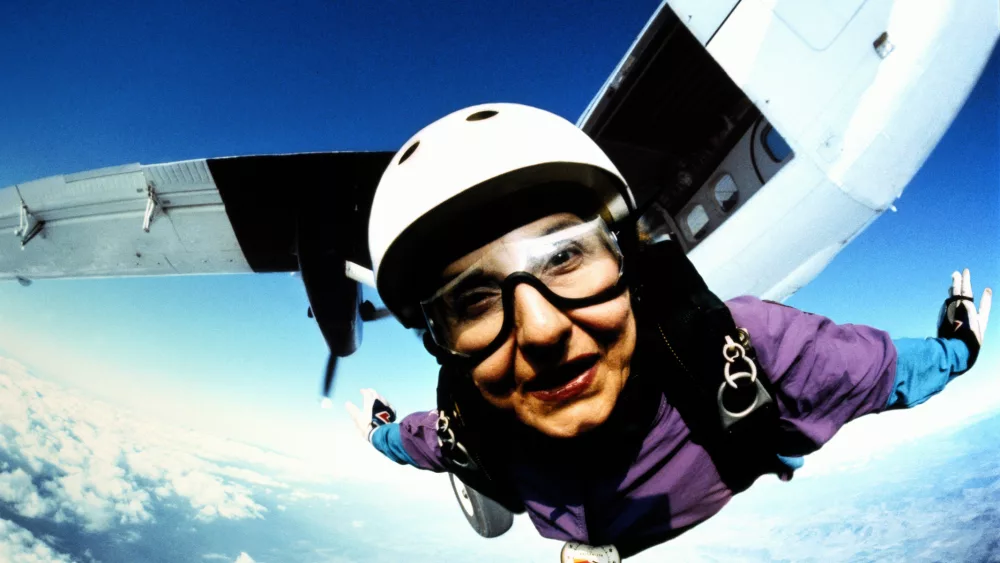skydiver-flying-in-mid-air-plane-in-background-close-up