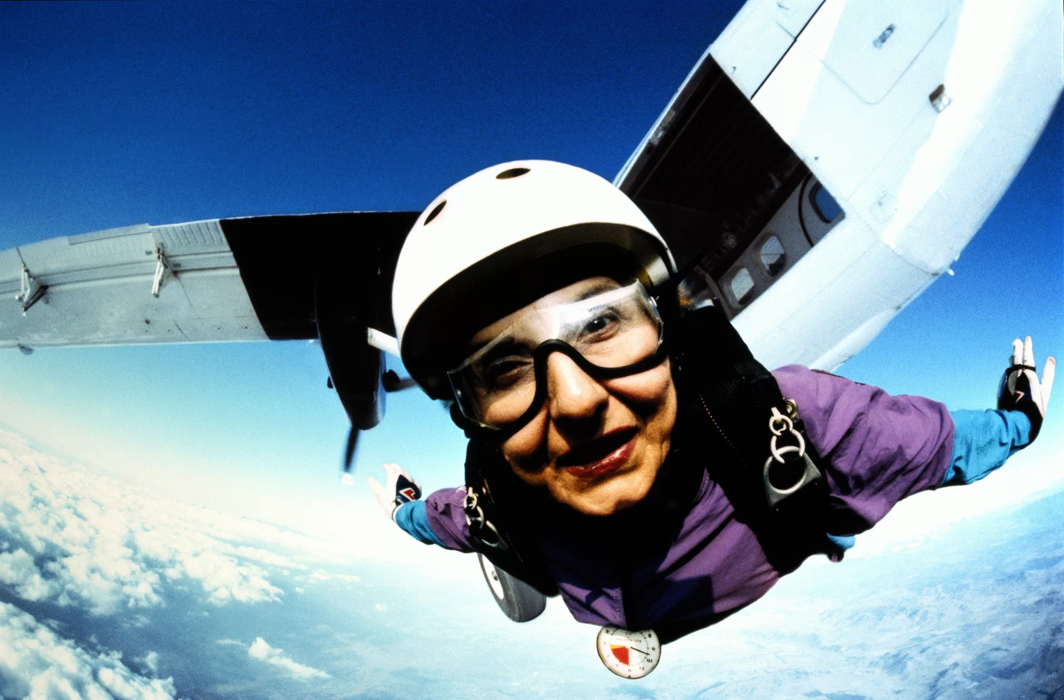 skydiver-flying-in-mid-air-plane-in-background-close-up