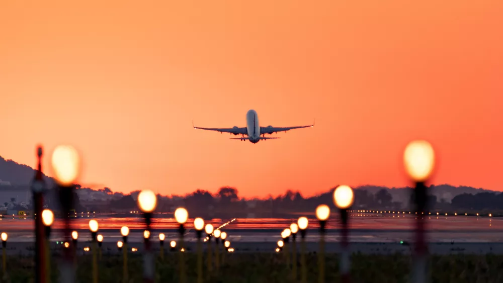 airplane-taking-off-at-sunrise-travel-and-tourism