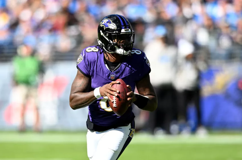 BALTIMORE, MARYLAND - OCTOBER 22: Lamar Jackson #8 of the Baltimore Ravens rolls out of the pocket against the Detroit Lions at M&T Bank Stadium on October 22, 2023 in Baltimore, Maryland. (Photo by G Fiume/Getty Images)