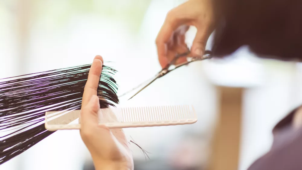 hairdresser-using-scissors-to-cut-hair