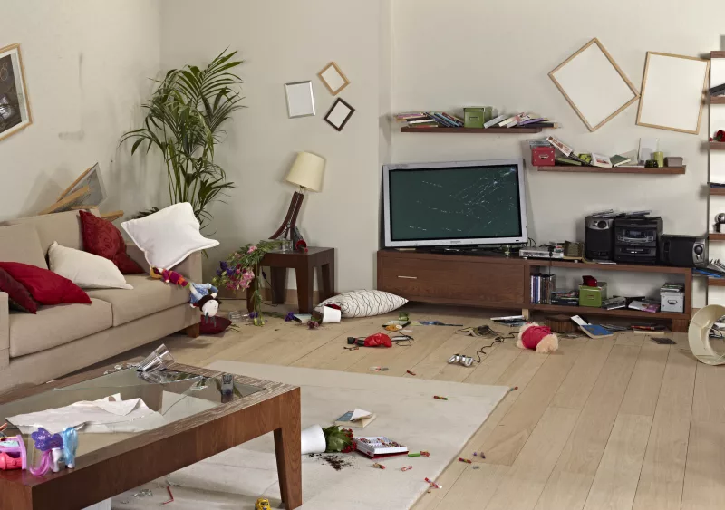 messy-living-room-with-damage