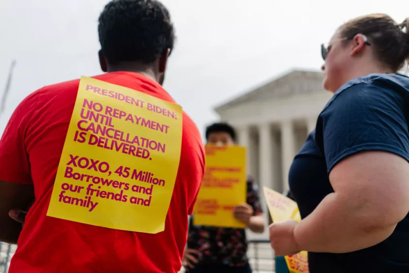 WASHINGTON, DC - JUNE 30: Student Debt relief advocates stand outside of the Supreme Court of the United States after the high court struck down President Biden's student debt relief program on Friday, June 30, 2023 in Washington, DC. In a 6-3 decision the Supreme Court stuck down the Biden administration's student debt forgiveness program in Biden v. Nebraska. (Kent Nishimura / Los Angeles Times via Getty Images)