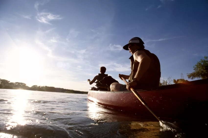 couple-canoeing-on-lake