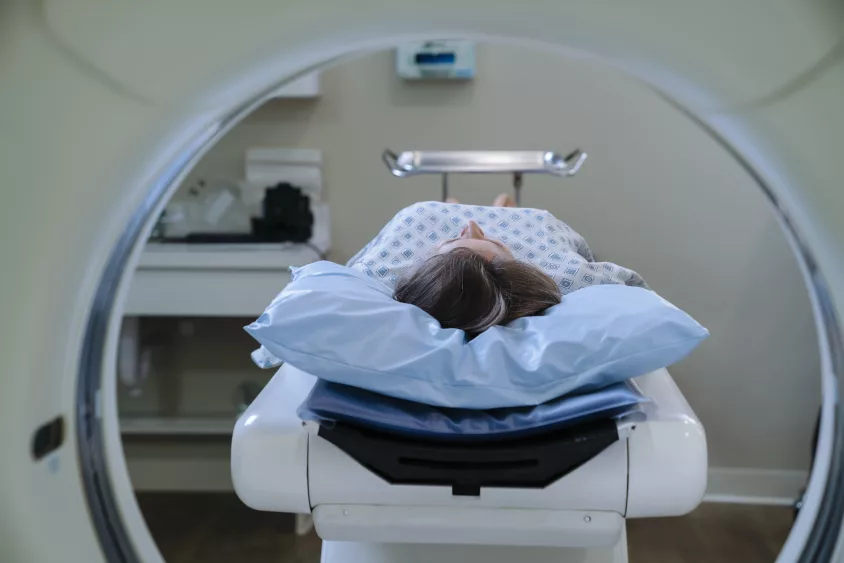 caucasian-patient-laying-on-scanner-table