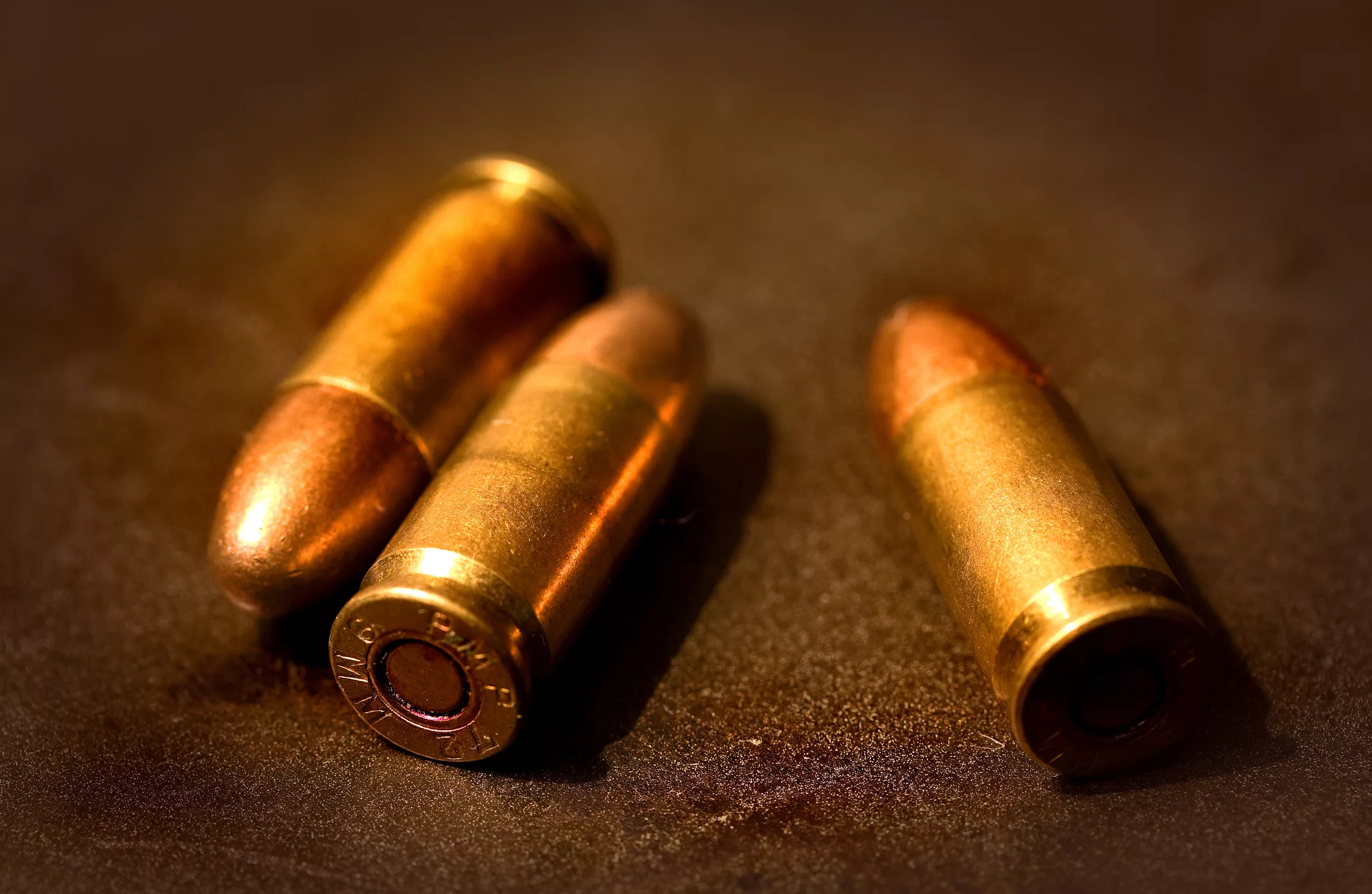 three-bullets-on-textured-background