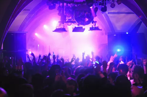 crowd-with-arms-in-air-at-nightclub-music