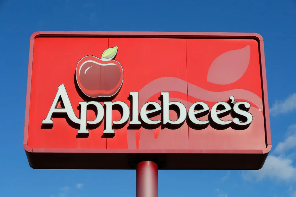 a-view-of-an-applebees-restaurant-sign-and-logo