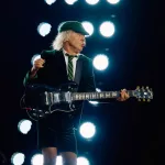 AC/DC Power Up Tour - Start of the European tour: 17 May 2024, North Rhine-Westphalia, Gelsenkirchen: AC/DC Power Up Tour - start of the German tour, Veltins Arena. Angus Young, lead guitarist, plays on the catwalk in front of the stage. Photo: Bernd Thissen/dpa (Photo by Bernd Thissen/picture alliance via Getty Images)