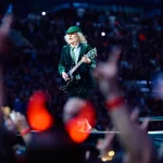 AC/DC Power Up Tour - Start of the German tour: 17 May 2024, North Rhine-Westphalia, Gelsenkirchen: AC/DC Power Up Tour - start of the German tour, Veltins Arena. Lead guitarist Angus Young plays on the catwalk in front of the stage. Photo: Bernd Thissen/dpa (Photo by Bernd Thissen/picture alliance via Getty Images)