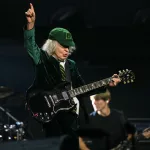 GERMANY-MUSIC-AC/DC: Angus Young, lead guitarist of Australian rock band AC/DC performs on stage during their "PowerUp Tour 2024" at the VELTINS-Arena in Gelsenkirchen, western Germany on May 17, 2024. (Photo by INA FASSBENDER / AFP) (Photo by INA FASSBENDER/AFP via Getty Images)