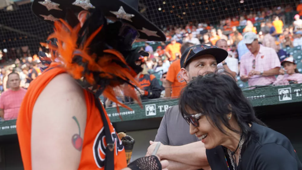Joan Jett, American rock singer, guitarist, and songwriter greets Justin Masterson aka Wesley Wild after throwing the ceremonial pitch on July 28 at 98 Rock Night 2024. (Photo Credit: Katarina Hein - Hearst)