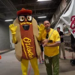 dsc02832: Scott Reardon, and the Orioles' Mustard Condiment Mascot pose ahead of the June 28 98 Rock Night Hot Dog Race. (Photo Credit: Katarina Hein - Hearst)