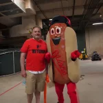 dsc02838: Josh Spiegel and the Orioles' Ketchup Condiment Mascot pose ahead of the June 28 98 Rock Night Hot Dog Race. (Photo Credit: Katarina Hein - Hearst)