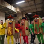 dsc02840: Justin Schlegel, Josh Spiegel, Scott Reardon, Amelia Ryerse and the Orioles' Condiment Mascots pose ahead of the June 28 98 Rock Night Hot Dog Race. (Photo Credit: Katarina Hein - Hearst)