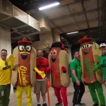 dsc02841: Justin Schlegel, Josh Spiegel, Scott Reardon, Amelia Ryerse and the Orioles' Condiment Mascots pose ahead of the June 28 98 Rock Night Hot Dog Race. (Photo Credit: Katarina Hein - Hearst)