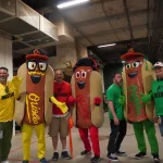 dsc02843: Justin Schlegel, Josh Spiegel, Scott Reardon, Amelia Ryerse and the Orioles' Condiment Mascots pose ahead of the June 28 98 Rock Night Hot Dog Race. (Photo Credit: Katarina Hein - Hearst)