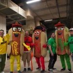 dsc02844: Justin Schlegel, Josh Spiegel, Scott Reardon, Amelia Ryerse and the Orioles' Condiment Mascots pose ahead of the June 28 98 Rock Night Hot Dog Race. (Photo Credit: Katarina Hein - Hearst)