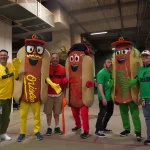 dsc02845: Justin Schlegel, Josh Spiegel, Scott Reardon, Amelia Ryerse and the Orioles' Condiment Mascots pose ahead of the June 28 98 Rock Night Hot Dog Race. (Photo Credit: Katarina Hein - Hearst)