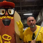 mustard1: Scott Reardon, and the Orioles' Mustard Condiment Mascot pose ahead of the June 28 98 Rock Night Hot Dog Race. (Photo Credit: Katarina Hein - Hearst)