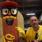 mustard3: Scott Reardon, and the Orioles' Mustard Condiment Mascot pose ahead of the June 28 98 Rock Night Hot Dog Race. (Photo Credit: Katarina Hein - Hearst)