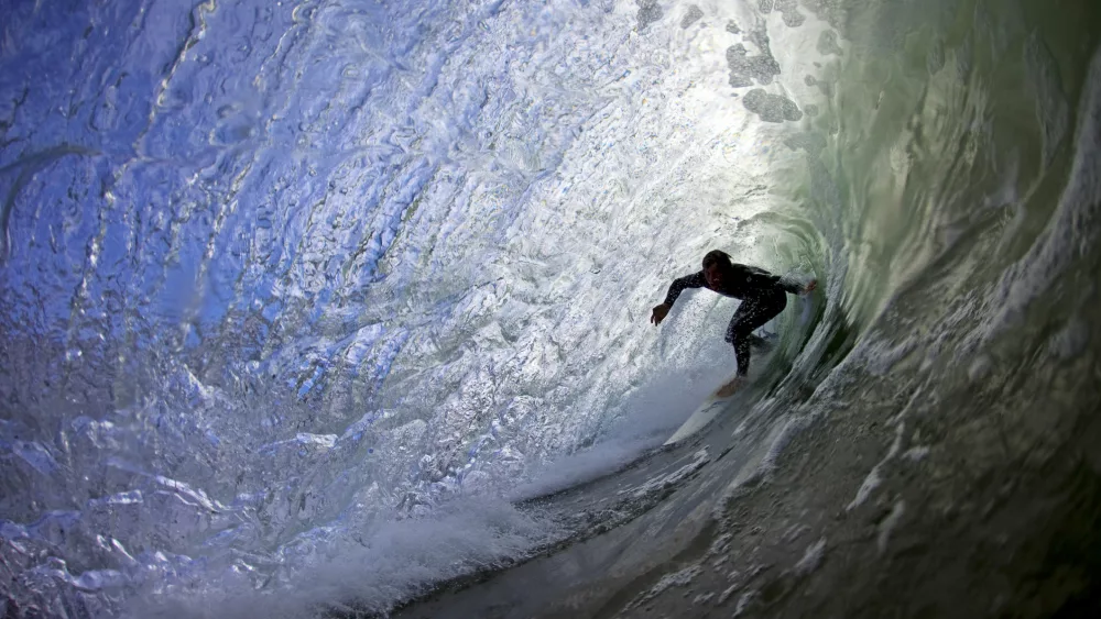 surfer-riding-a-tube