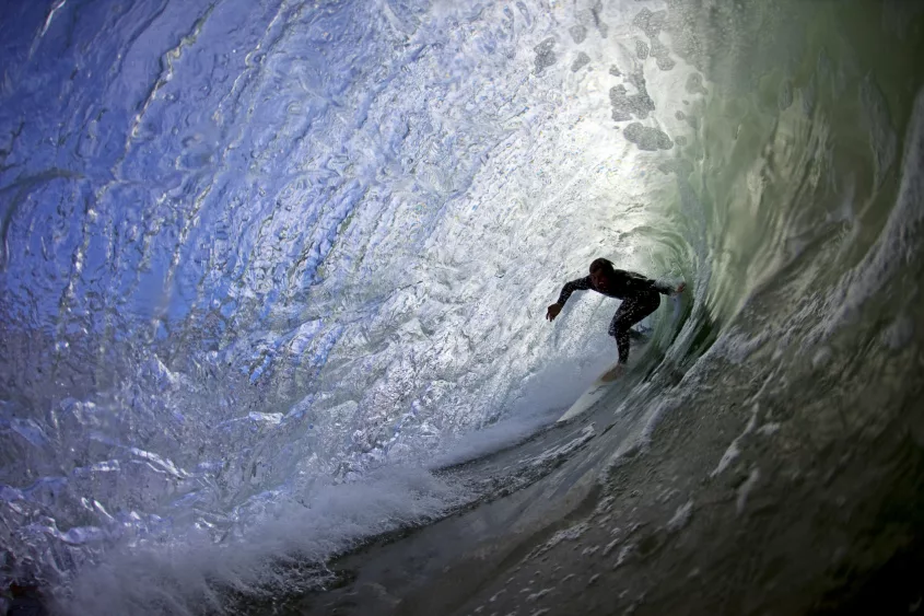 surfer-riding-a-tube