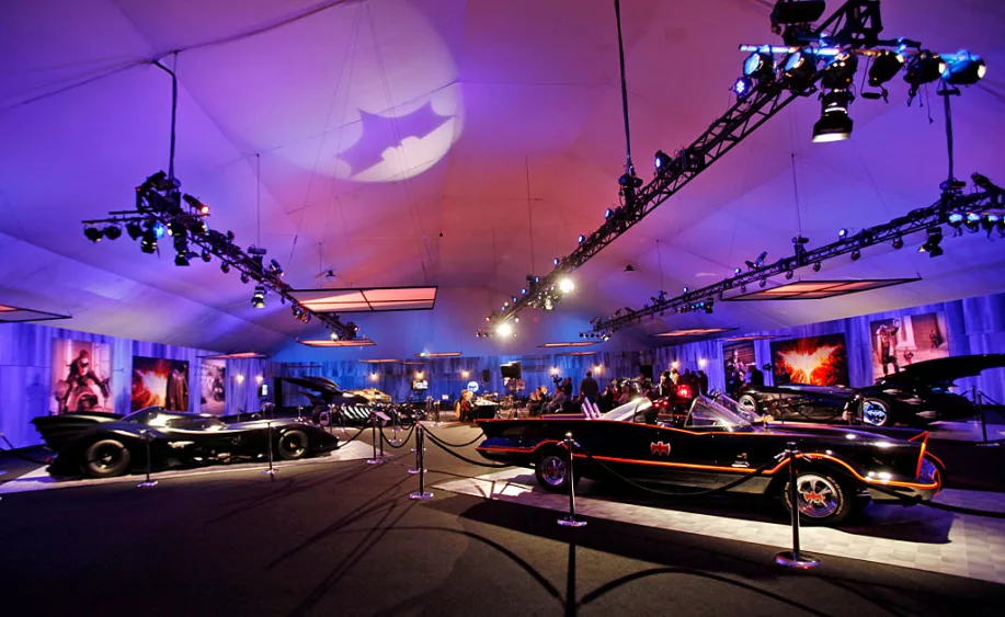 a-batmobile-created-by-george-barris-right-sits-close-to-the-keaton-batmobile-left-in-a-display