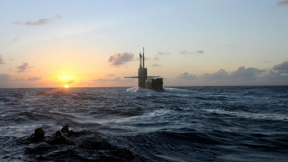 pacific-ocean-feb-20-2012-seals-and-divers-from-seal-delivery-vehicle-team-sdvt-1-swim-back-to-the-guided-missile-submarine-uss-michigan-ssgn-727-during-an-exercise-for-certification-on-seal-d