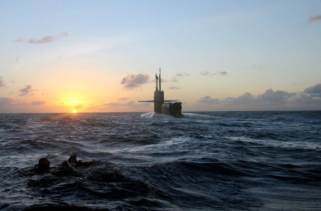 pacific-ocean-feb-20-2012-seals-and-divers-from-seal-delivery-vehicle-team-sdvt-1-swim-back-to-the-guided-missile-submarine-uss-michigan-ssgn-727-during-an-exercise-for-certification-on-seal-d