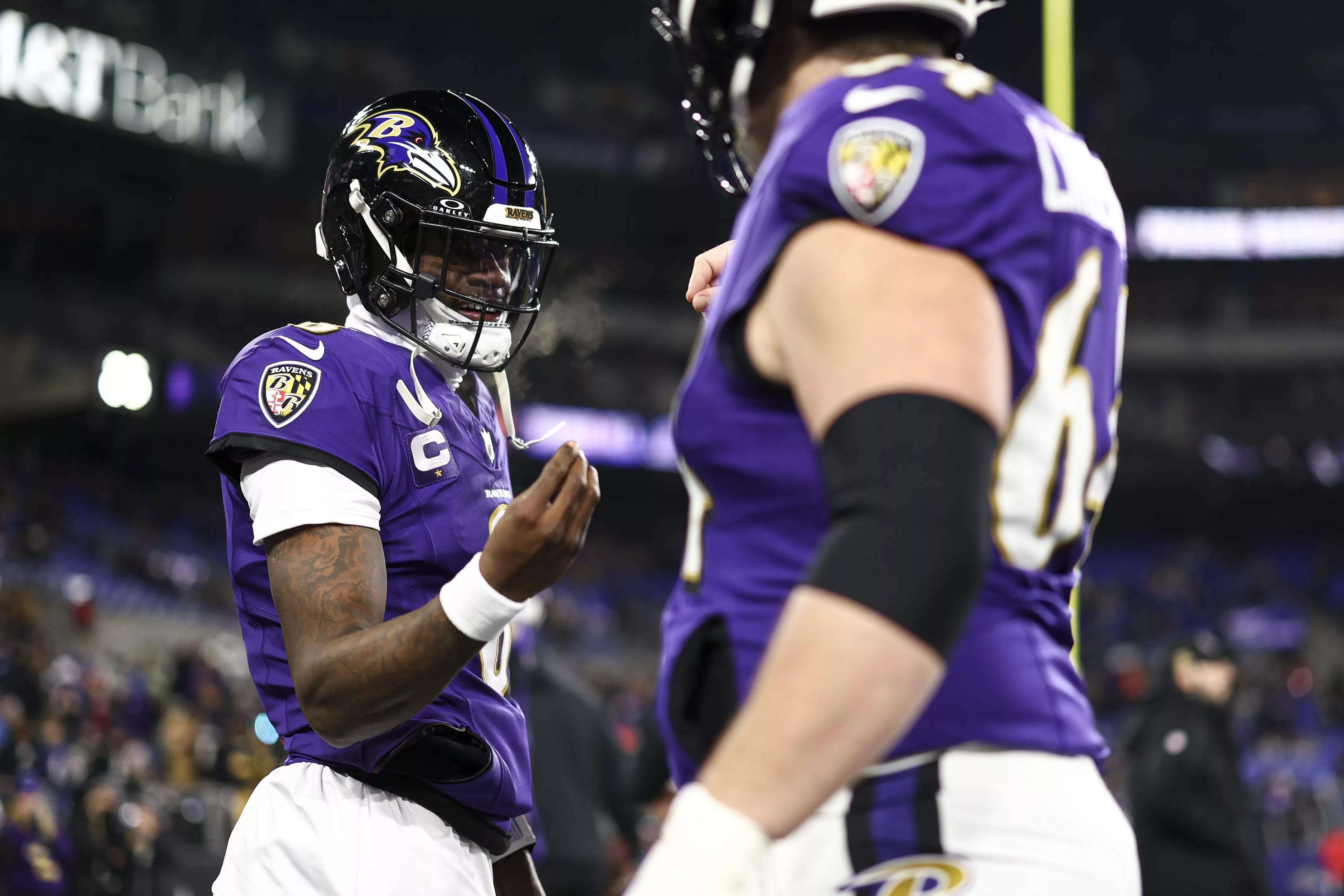 BALTIMORE, MARYLAND - JANUARY 11: Lamar Jackson #8 of the Baltimore Ravens warms up with Tyler Linderbaum #64 prior to an NFL football wild card playoff game against the Pittsburgh Steelers at M&T Bank Stadium on January 11, 2025 in Baltimore, Maryland. (Photo by Kevin Sabitus/Getty Images)