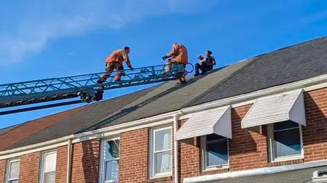 Baltimore County police officer rescues dog from roof in Dundalk | 98 ...