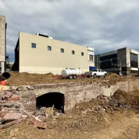 As cleanup continues at the demolition site of a downtown Galesburg building at Main and Prairie streets^ interesting finds and artifacts emerge. One appears to be an underground tunnel or entrance way under the sidewalk in the first block of North Prairie Street.