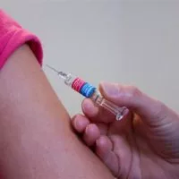 A person receives a vaccine.