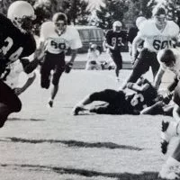 With fullback Jerry Cato leading the way as a blocker^ TJ Pendleton carries the ball for the Galesburg Silver Streaks.