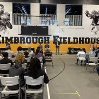 A vibrant mural of Albert and Elbert Kimbrough^ frozen in their 1950s football glory^ now graces the newly christened Kimbrough Fieldhouse at Galesburg Jr./Sr. High School^ unveiled during a heartfelt dedication ceremony on Sunday^ May 25^ 2025.