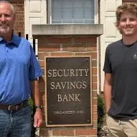 Security Savings Bank President/CEO Brad Ray^ left^ and Jackson Gillen.