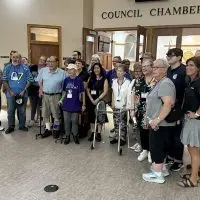 VNA Community Services supporters assemble after after the Monday^ Sept. 15^ 2025^ City Council meeting.
